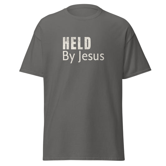 Charcoal t shirt that says "Held by Jesus"